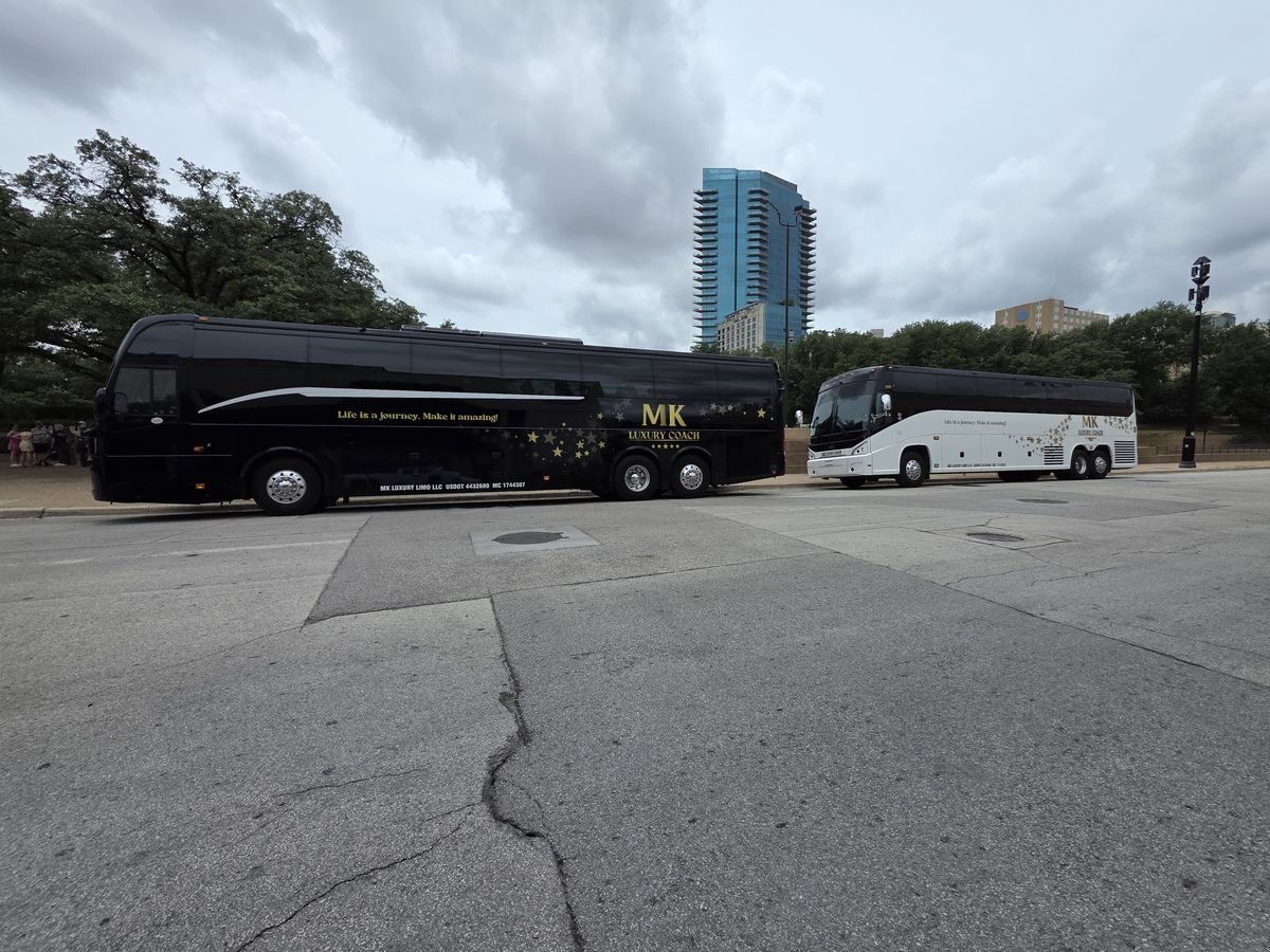 MK Luxury Coach motor coaches with the Dallas skyline in the background
